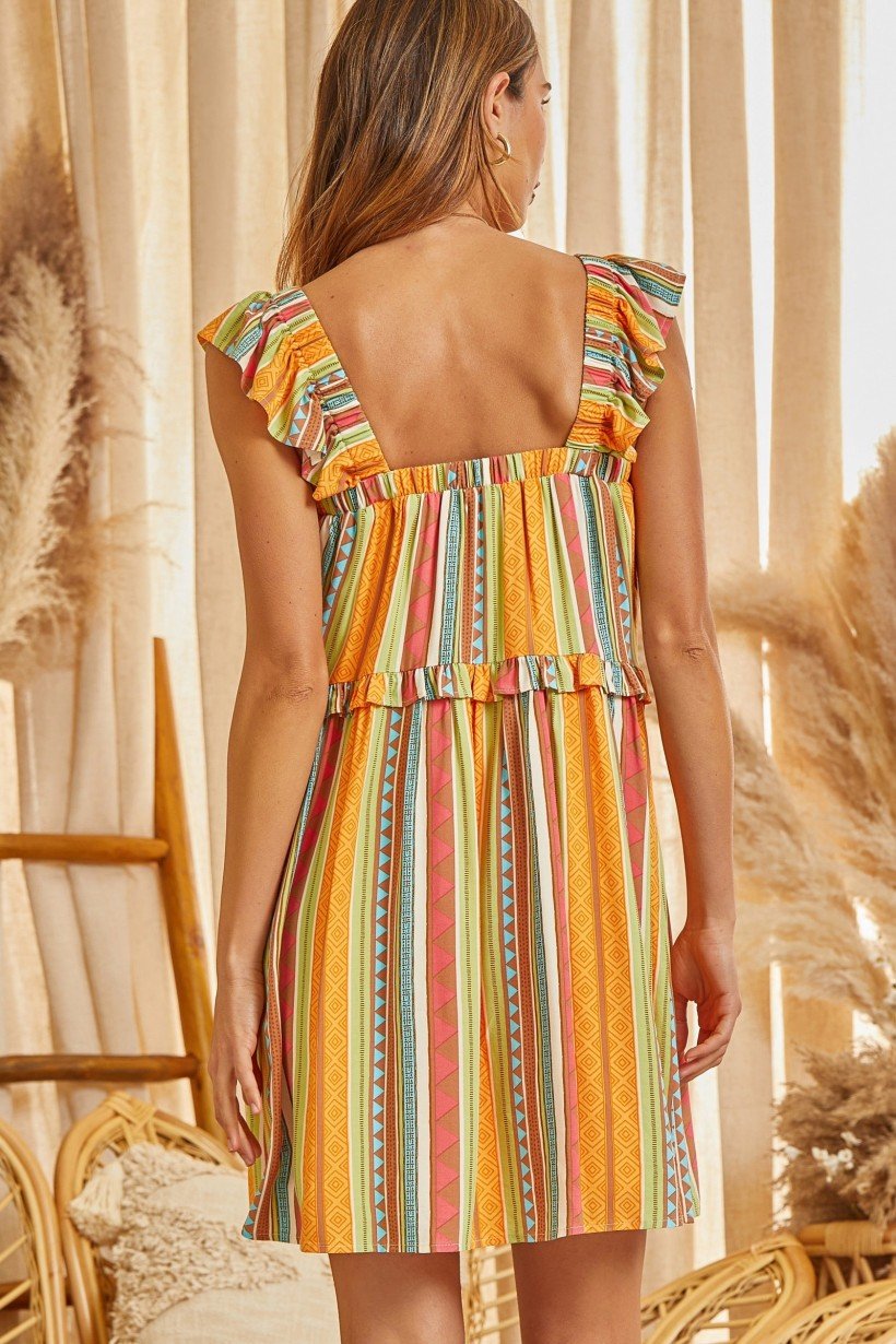 Back view of the Walking on Sunshine Dress from Raggdoll Boutique, showcasing colorful striped pattern and trendy summer style.