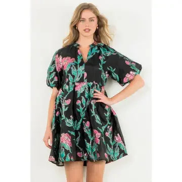 Tamara Dress in black with floral design, perfect for beach outings and tropical vacations. Stylish addition to Port Aransas boutique.