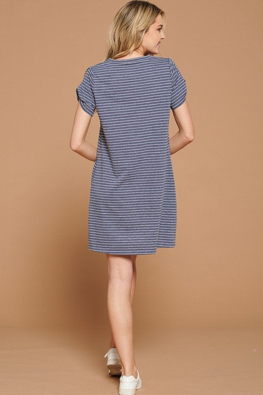 Back view of the DENIM AND WHITE TWIST SLEEVE KNIT DRESS from Raggdoll Boutique, a trendy coastal style for summer outfits.