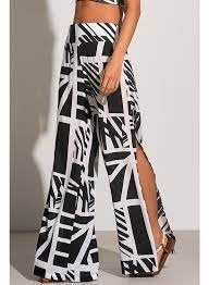 Stylish BARBADOS PRINT PANTS featured at Raggdoll Boutique, perfect for summer outfits and coastal fashion.