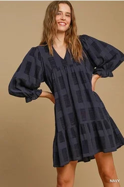 High neck jacquard mini dress, perfect for coastal boutique clothing and tropical vacations. Stylish addition to any beach wardrobe.