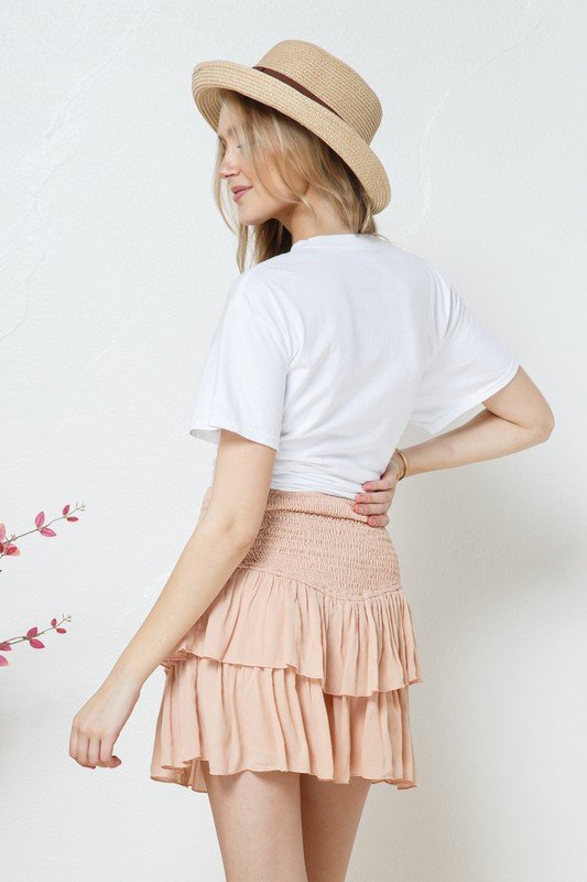SHAKE YOUR POM POMS PINK RUFFLE SKORT styled with a white top, perfect for summer outfits Texas.