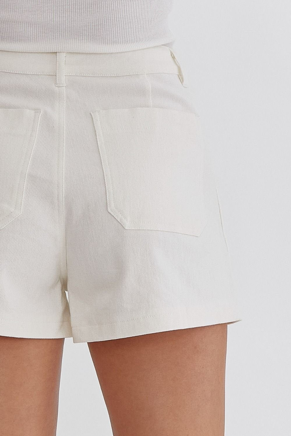 White Front Pocket Shorts featuring a stylish back view, perfect for summer outfits Texas at Raggdoll Boutique.