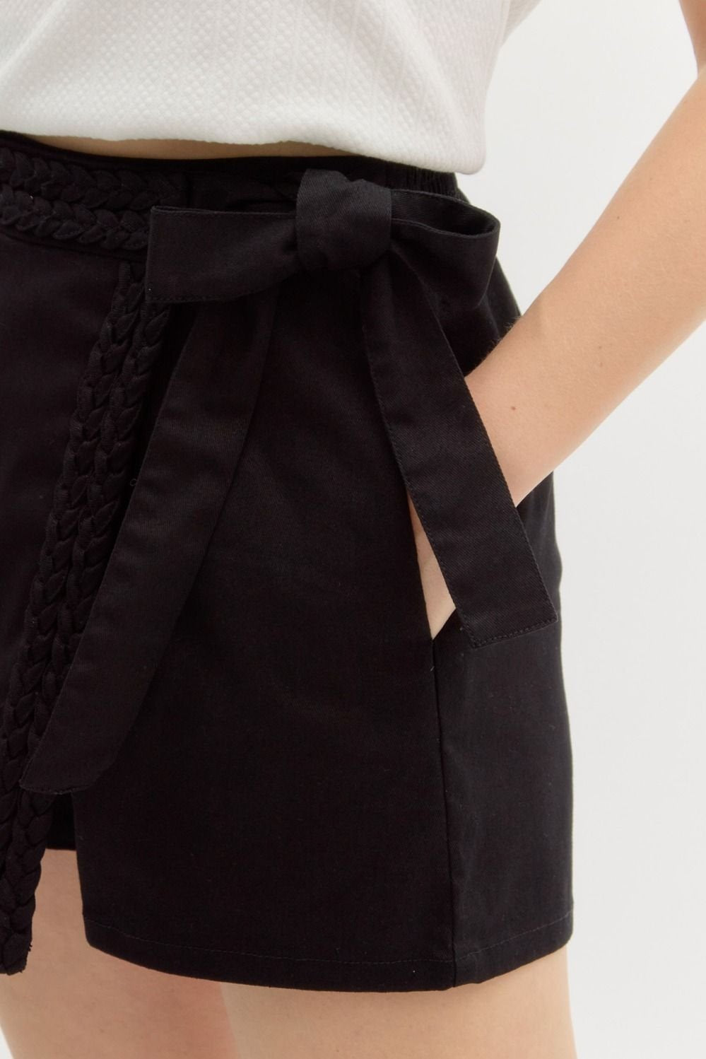 Cutest black skort with braid detail, perfect for spring from a Port Aransas boutique. Ideal for stylish women's bottoms.