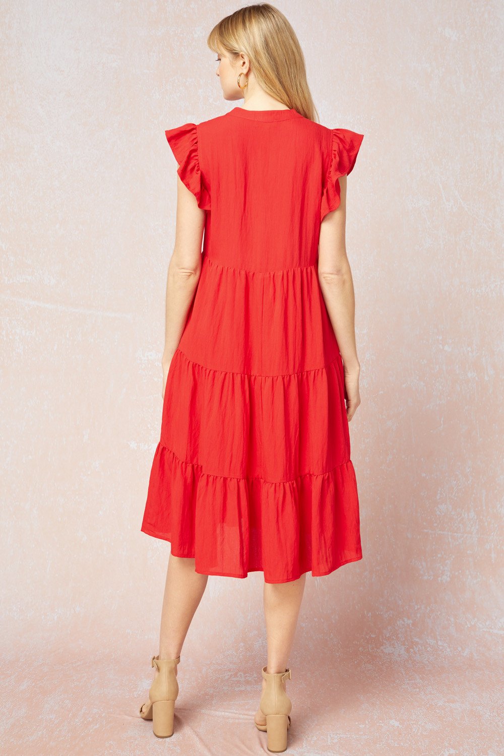 Back view of a lightweight RED TIERED DRESS from Raggdoll Boutique, perfect for summer outfits in Port Aransas.