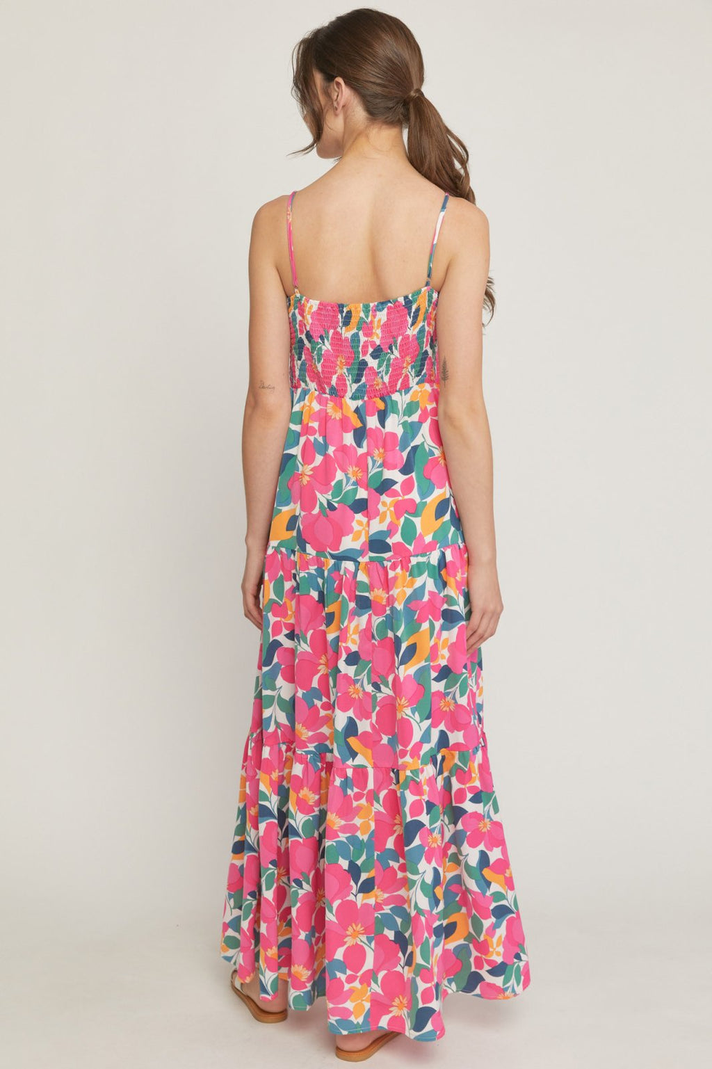 Back view of the FLIRTY IN FLORAL MIDI DRESS featuring vibrant colors, ideal for summer outfits Texas from Raggdoll Boutique.