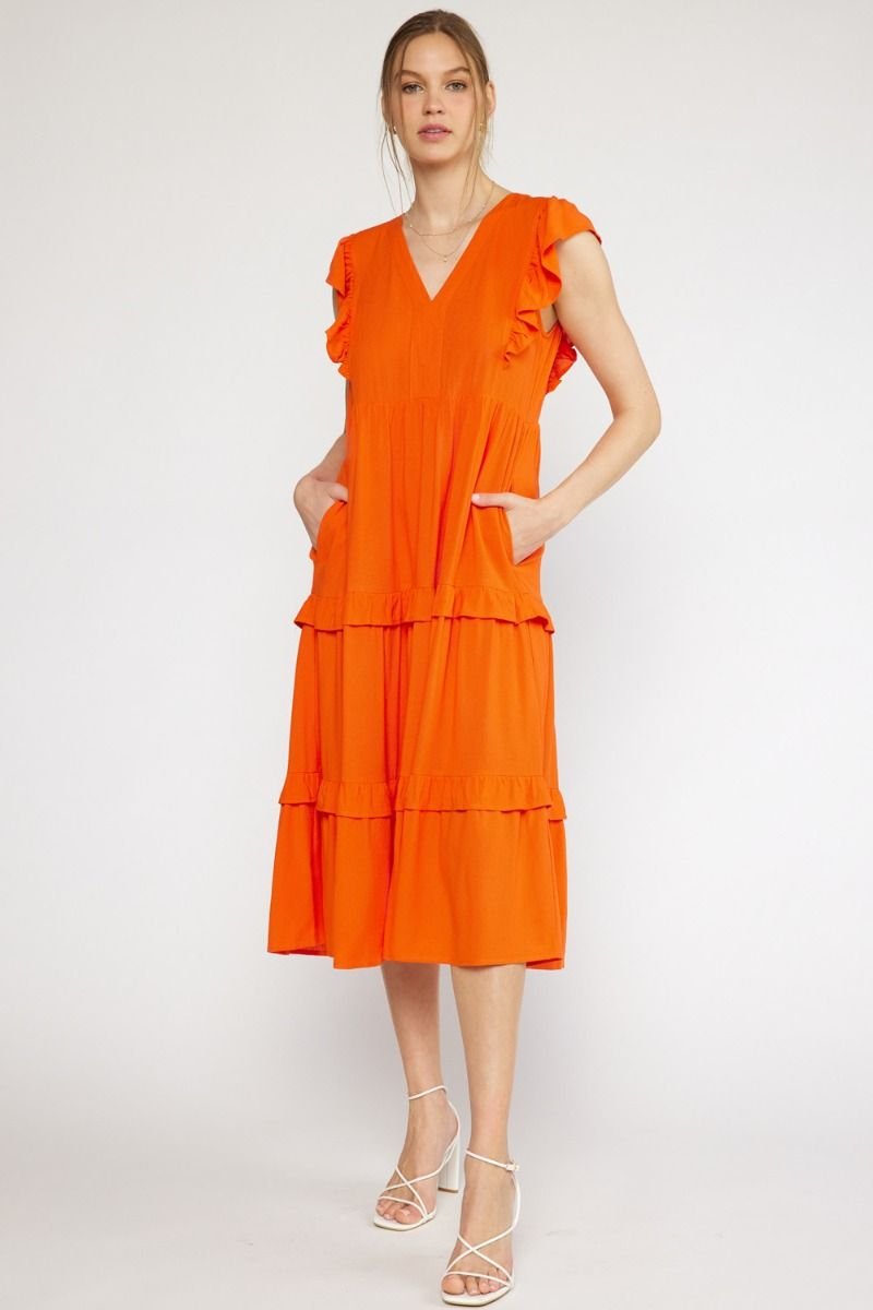 COAST TO COAST DRESS in vibrant orange with ruffle sleeves, ideal for trendy coastal style from Raggdoll Boutique.