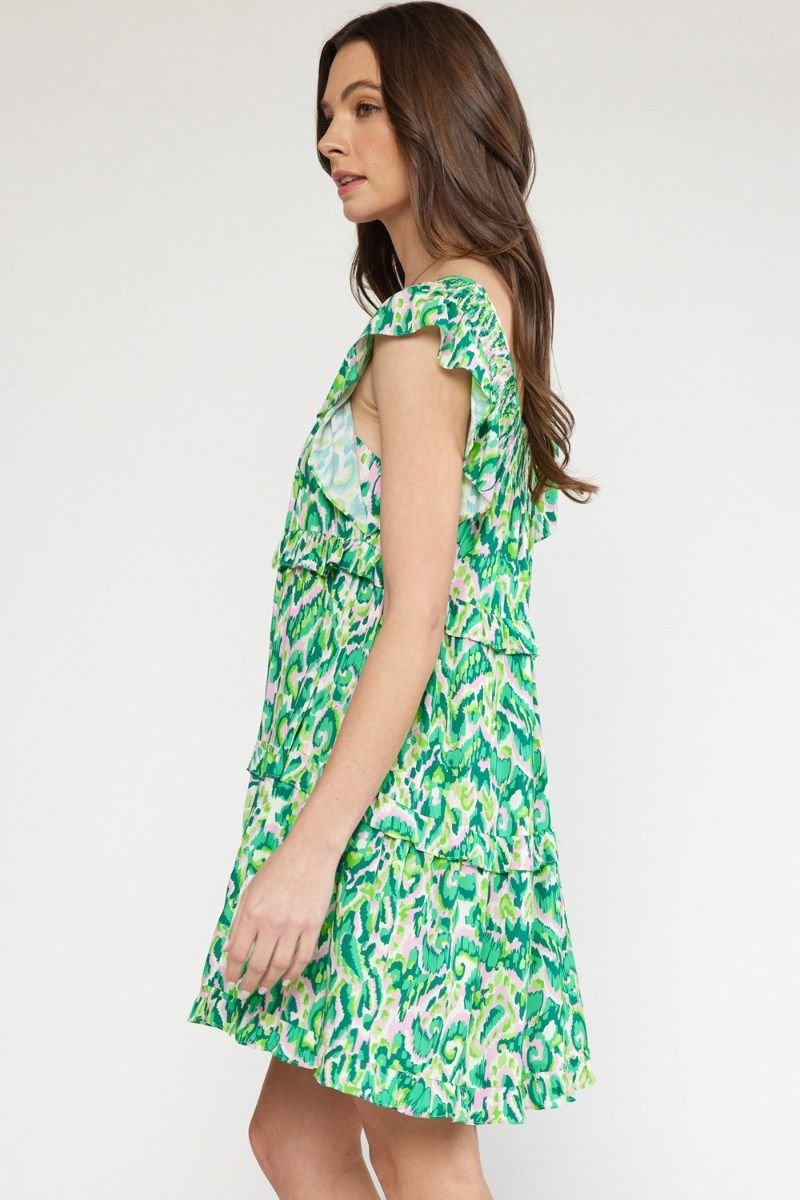 Girls Love Swirls dress, a stylish green beach dress from a coastal boutique, perfect for tropical vacations.
