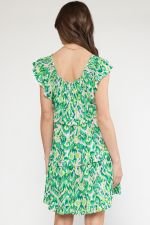 Stylish green dress with ruffle sleeves, perfect for coastal boutique clothing and tropical vacations.