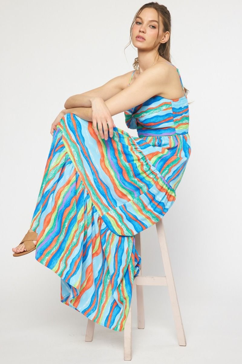 Model wearing BLUE WAVES MIDI DRESS by Raggdoll Boutique, showcasing trendy coastal style and colorful waves.