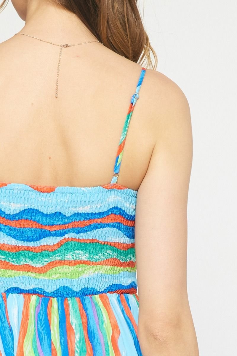 Back view of BLUE WAVES MIDI DRESS, colorful straps, trendy coastal style from Raggdoll Boutique.