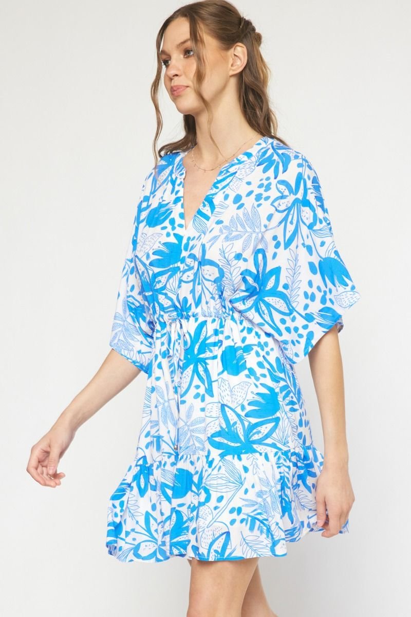 Blue floral dress from a coastal boutique, perfect for beach outings and tropical vacations. Curated women's fashion.