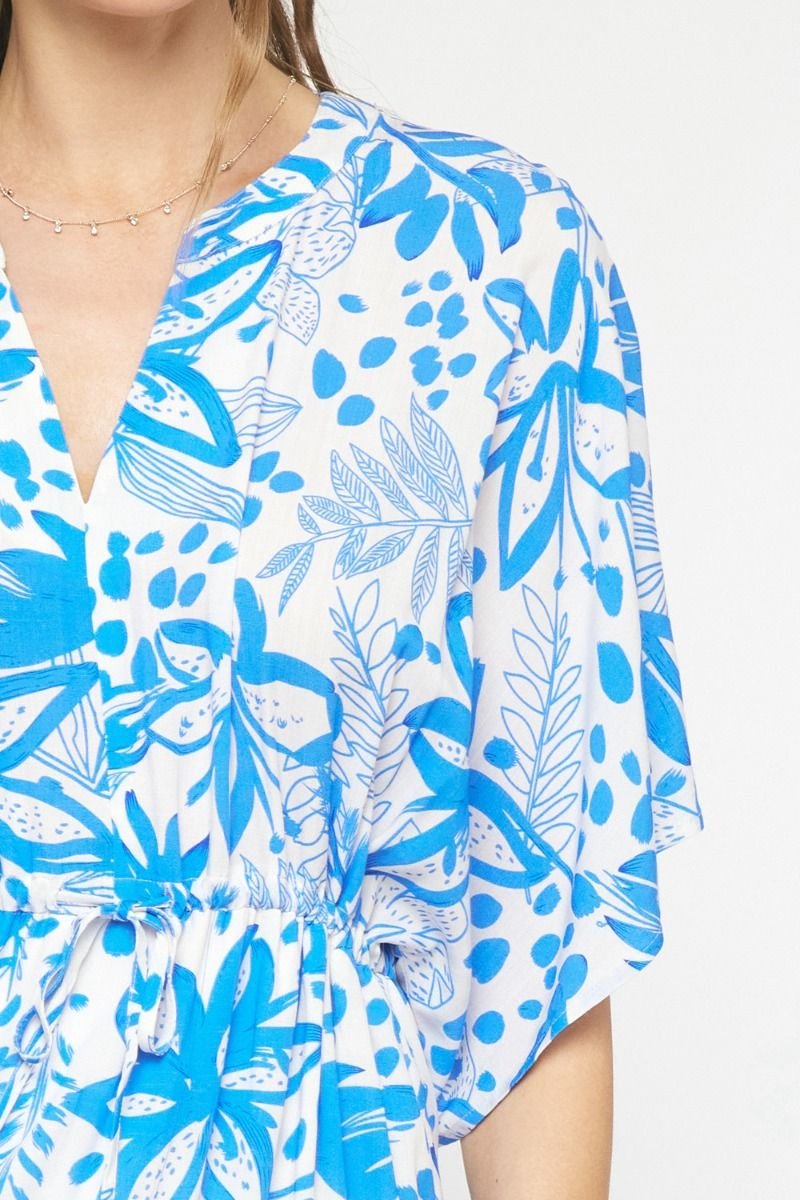 Blue floral print dress from coastal boutique clothing, perfect for beach outings and tropical vacations.