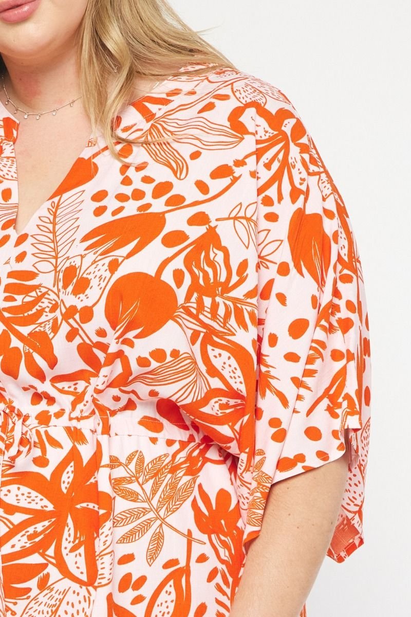 PLUS MIMOSA TIME DRESS featuring a vibrant floral design in orange, perfect for trendy coastal style at Raggdoll Boutique.