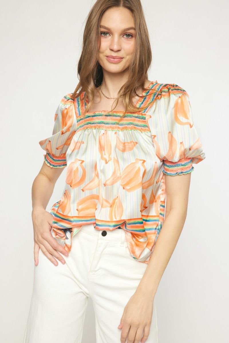 Model wearing ORANGE MULTI TOP from Raggdoll Boutique, perfect for summer outfits Texas and trendy coastal style.