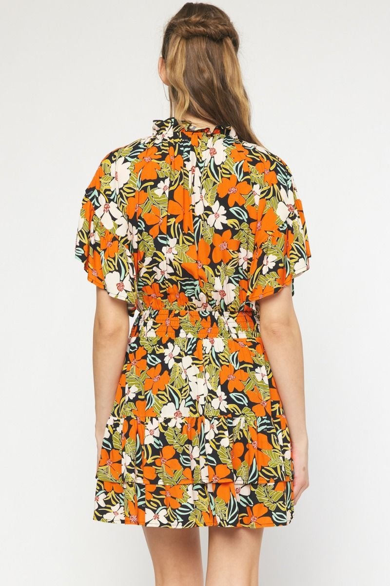Woman wearing FIELD OF FLOWERS DRESS from Raggdoll Boutique, showcasing trendy coastal style and summer outfits Texas.