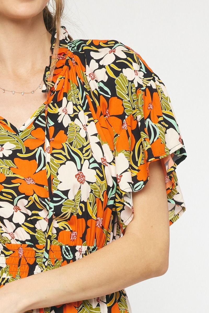 FIELD OF FLOWERS DRESS showcasing vibrant floral print, perfect for summer outfits Texas from Raggdoll Boutique.