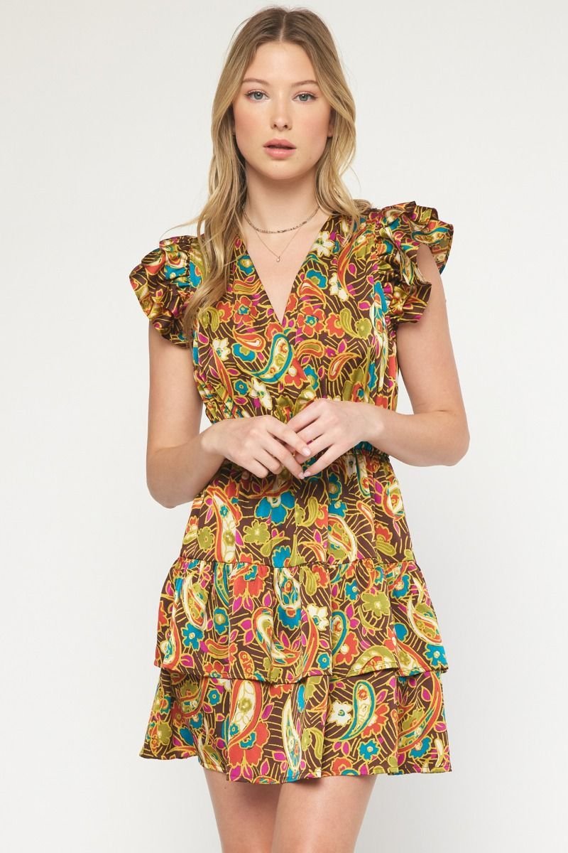 IT'S A DATE DRESS from Raggdoll Boutique, featuring vibrant colors and ruffled sleeves, perfect for a coastal fashion look.