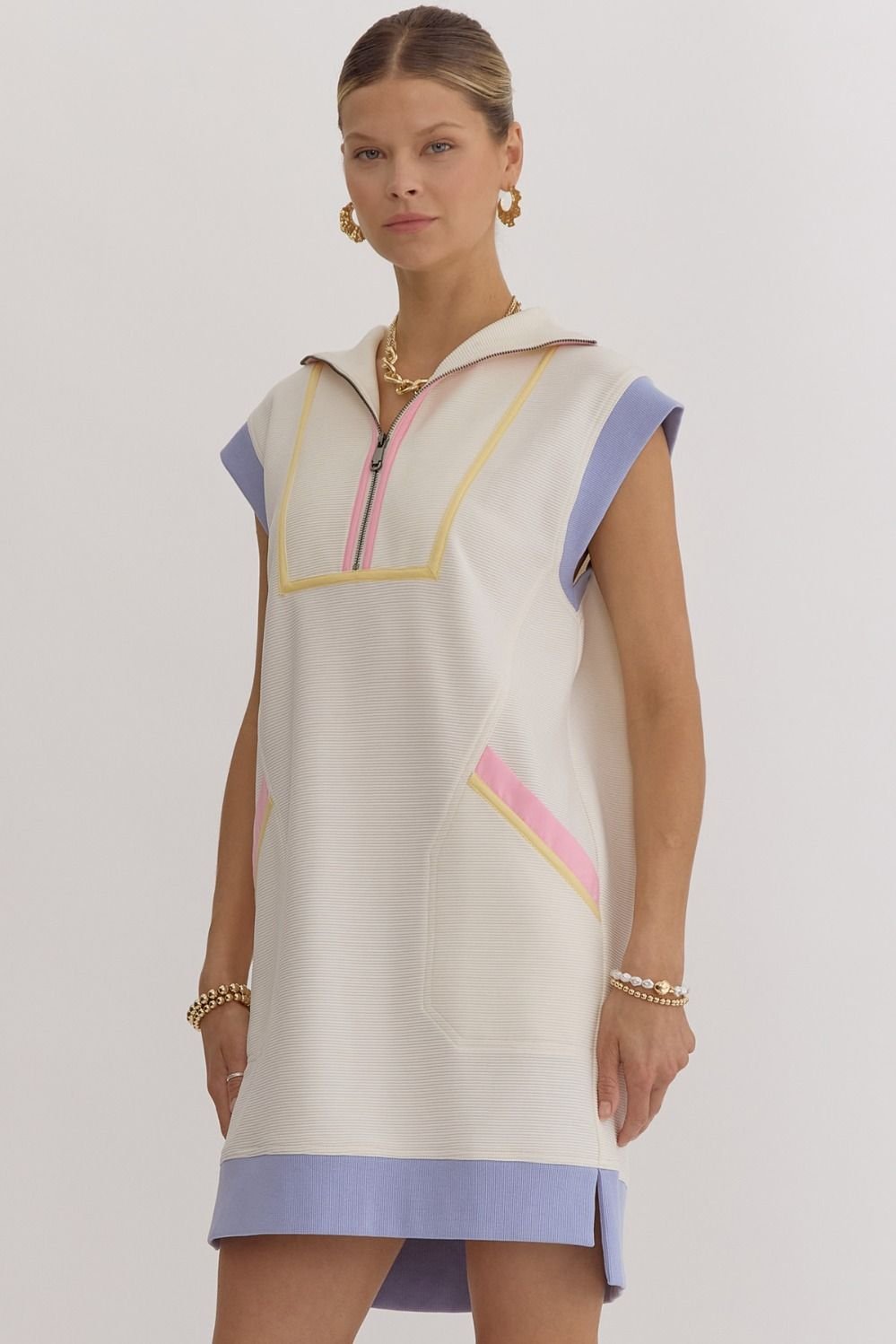Stylish Kelly Dress from Port Aransas boutique, ideal for tropical vacations, featuring vibrant colors and pocket details.