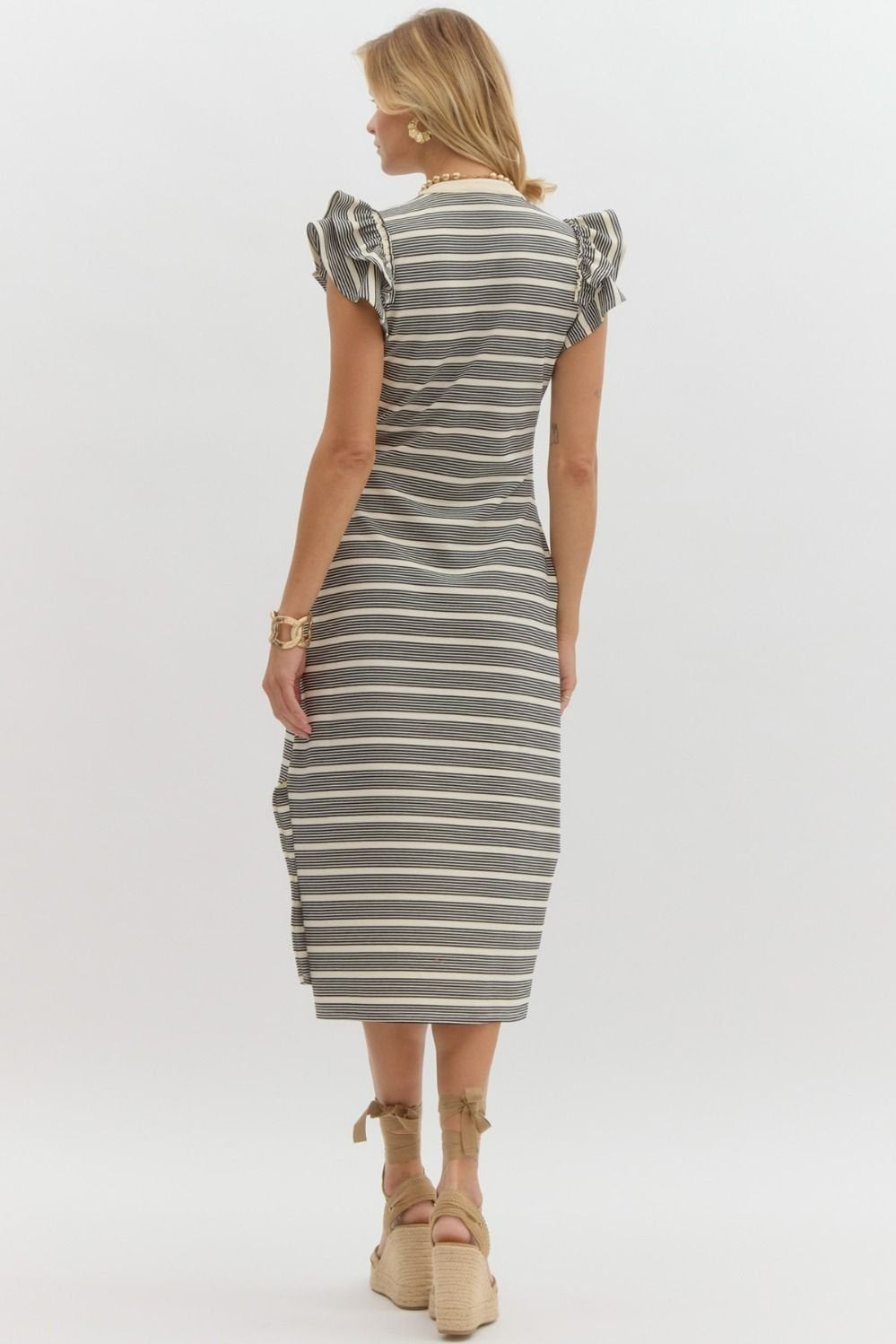 Tori Dress in striped design, perfect for coastal boutique clothing and tropical vacation outfits, styled with cute sandals.