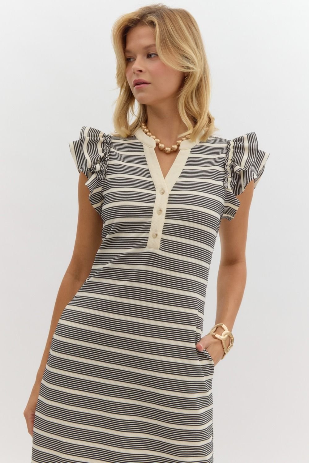 Tori Dress featuring stylish stripes, perfect for tropical vacations. Available at Port Aransas boutique.