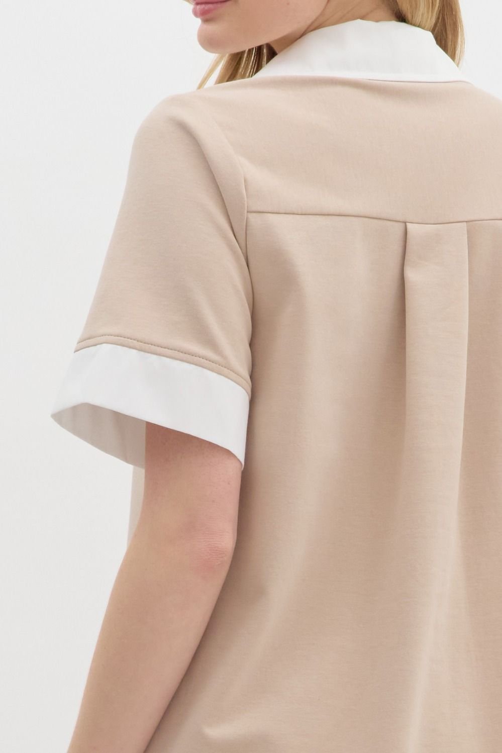 Back view of the Lara Dress, featuring a stylish beige fabric with white collar, perfect for coastal boutique clothing.