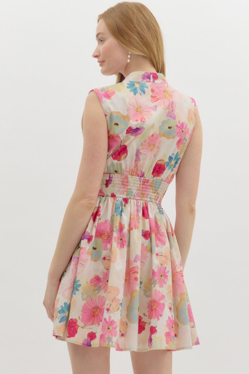 Floral summer mini dress in berry hue, perfect for coastal boutique clothing and tropical vacations.