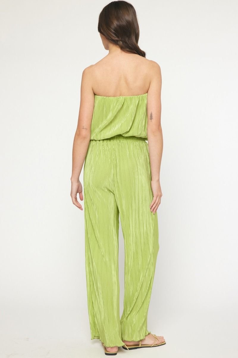 Back view of the APPLE GREEN JUMPSUIT from Raggdoll Boutique, showcasing trendy coastal style for summer outfits Texas.