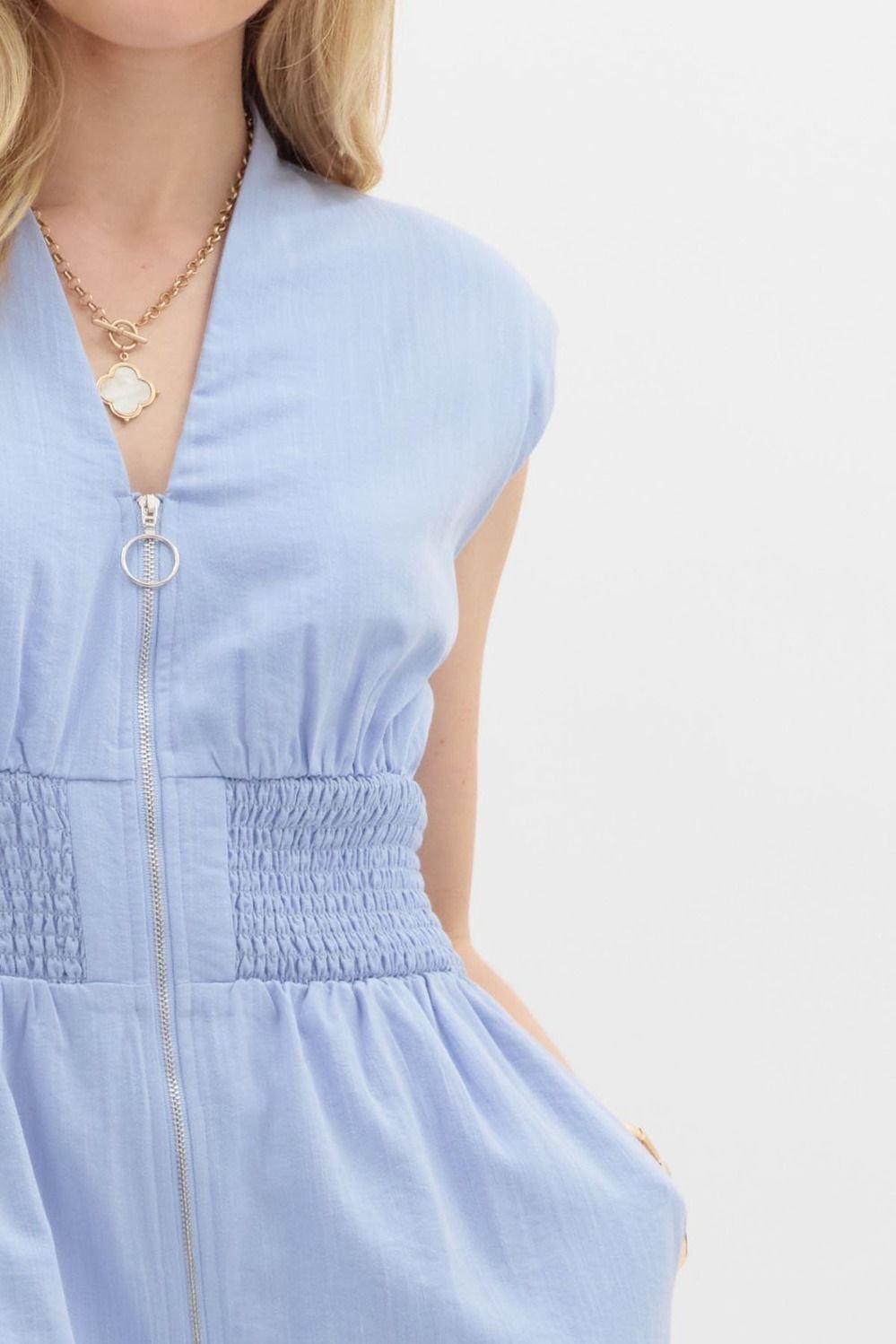 Stylish chambray jumpsuit with front zipper, perfect for spring events, from a Port Aransas boutique.
