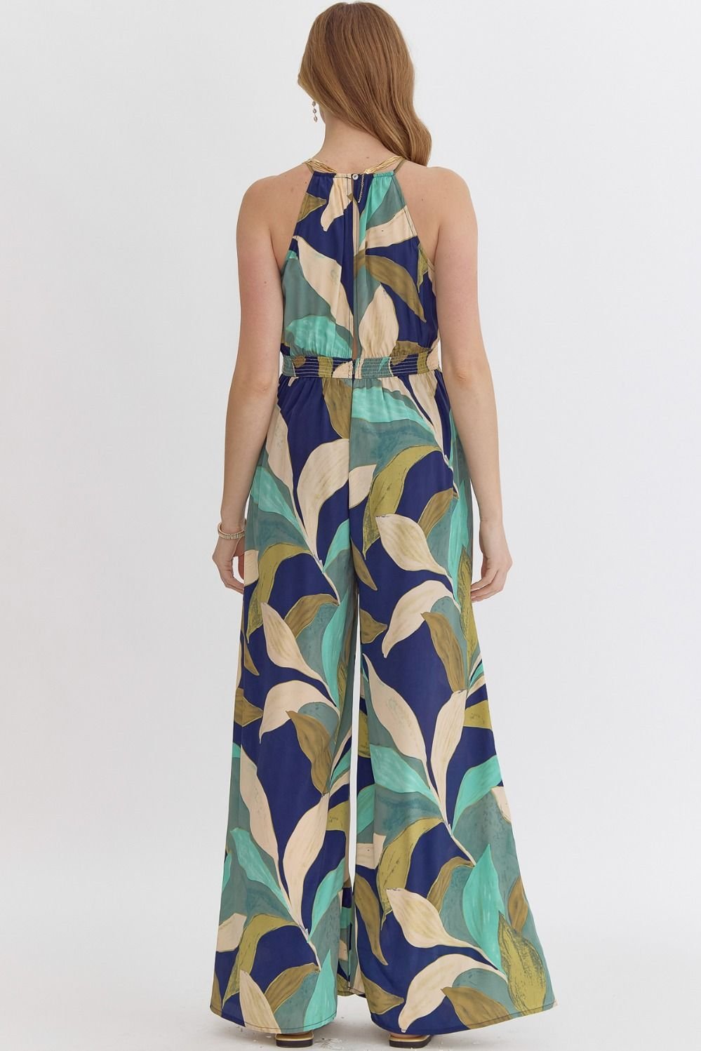 Navy and greens jumpsuit with tropical leaf print, perfect for coastal boutique clothing and curvy plus size fashion.
