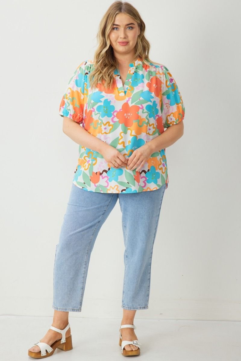 PLUS ENTRO MULTI-TOP in vibrant floral pattern, a trendy women's clothing option from Raggdoll Boutique in Port Aransas.