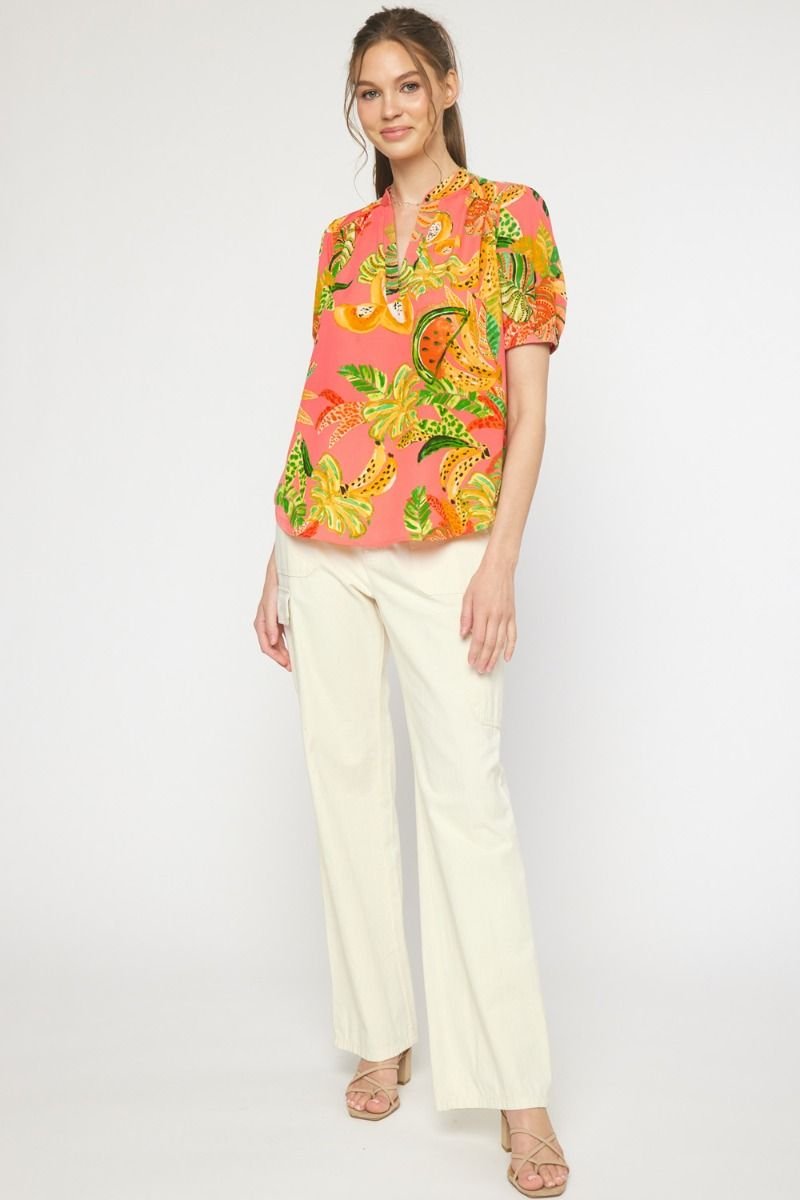Stylish pink multi-top from a coastal boutique, featuring tropical print, perfect for beach dresses and curvy plus size fashion.