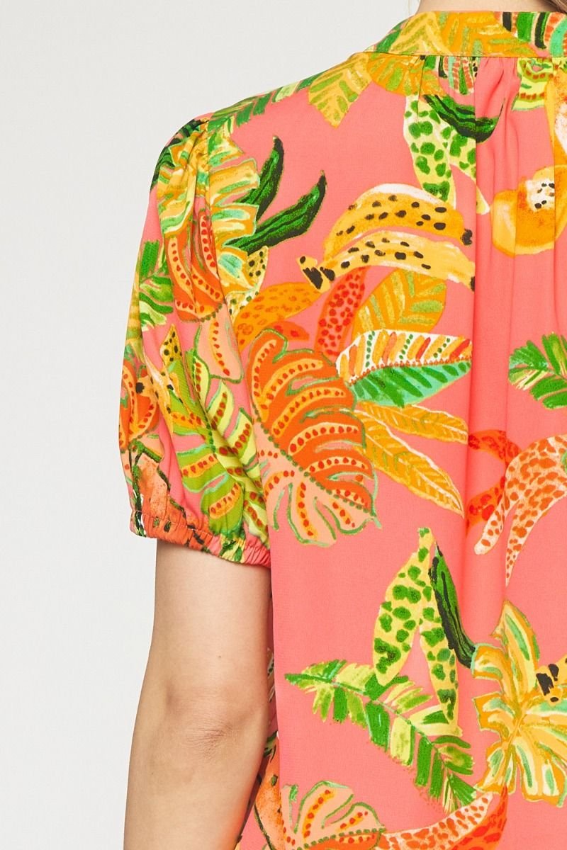Vibrant pink multi top with tropical leaf pattern, perfect for coastal boutique clothing and beach dresses.