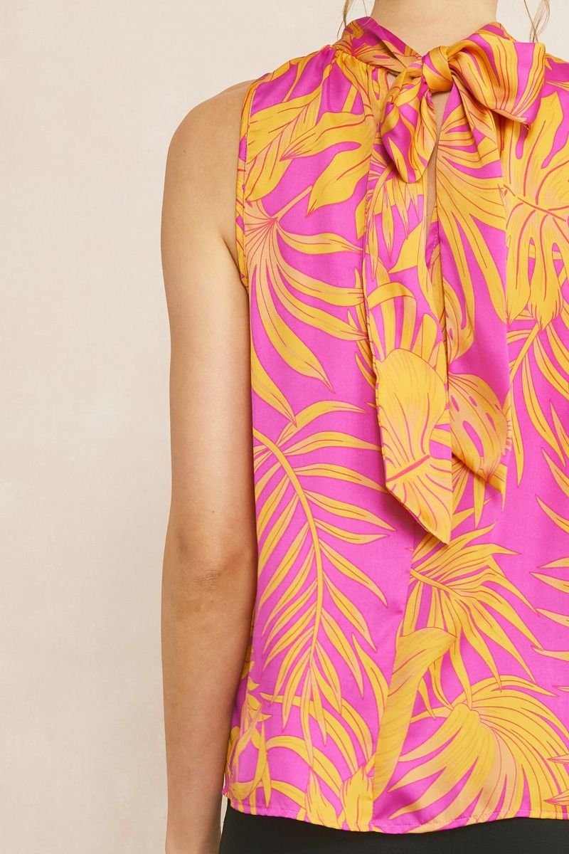 ORCHID AND ORANGE HALTER-STYLE TOP from Raggdoll Boutique, featuring vibrant tropical patterns, perfect for coastal fashion.