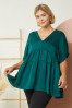 PLUS HUNTER GREEN TOP stylishly showcased at Raggdoll Boutique, perfect for summer outfits Texas.