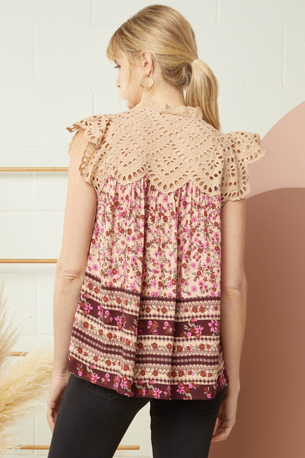 Floral and lace top showcasing a v-neck and ruffle sleeve, perfect for coastal boutique clothing and tropical vacation dresses.
