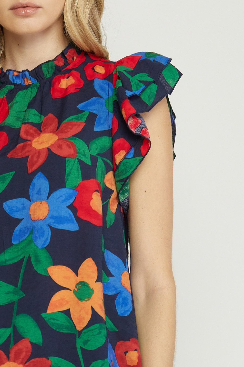 Navy Top with Flowers featuring colorful floral design, perfect for trendy coastal style from Raggdoll Boutique.