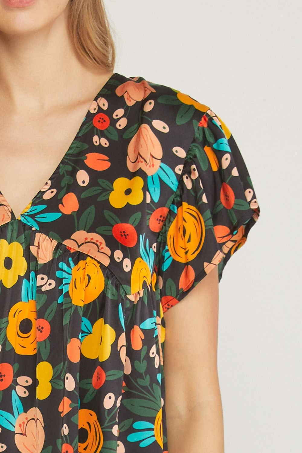 BLACK FLOWER PRINT TOP from Raggdoll Boutique, a trendy coastal style perfect for summer outfits in Texas.