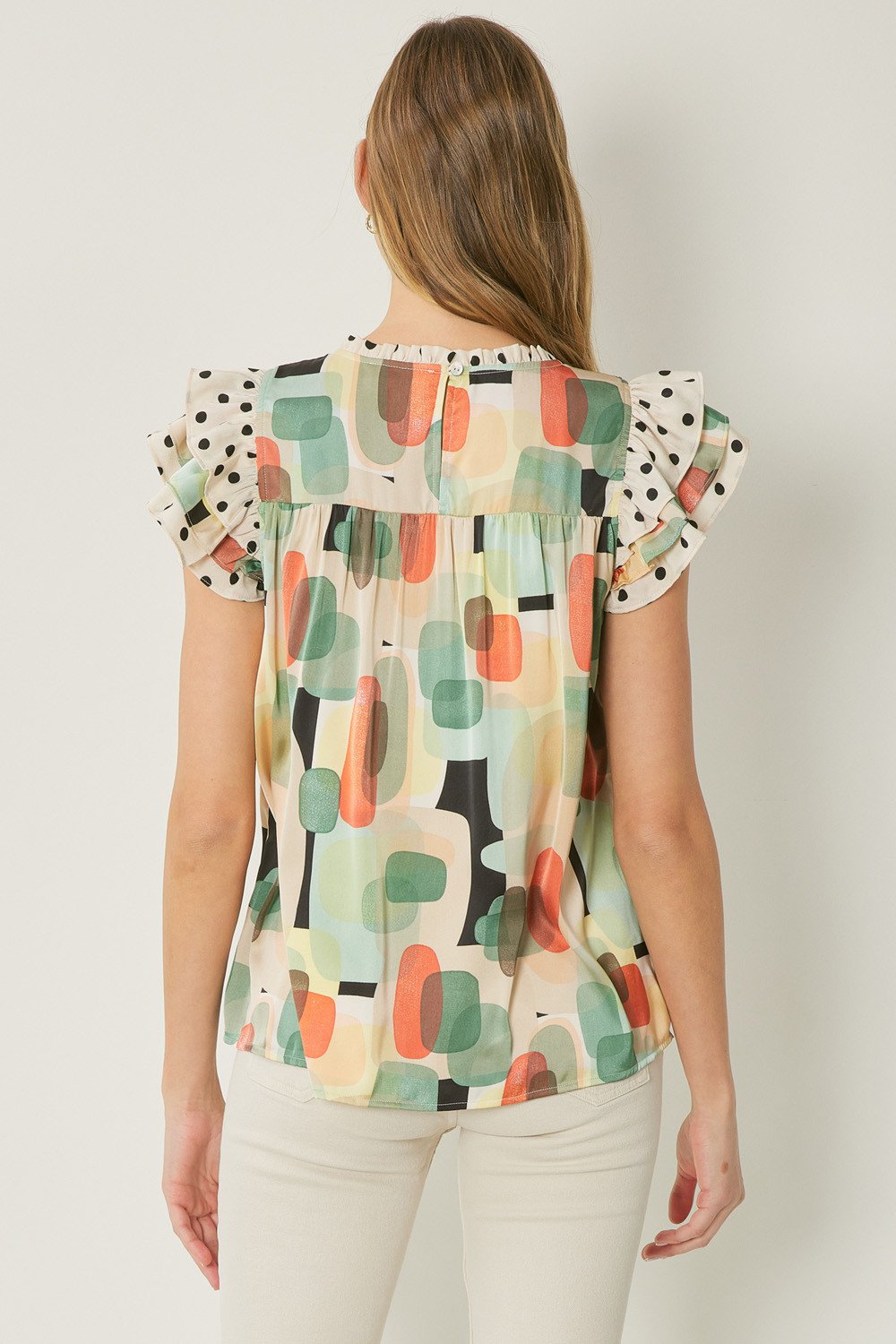BLACK, GREEN, CORAL DOT RUFFLE TOP from Raggdoll Boutique, perfect for trendy coastal style and summer outfits in Texas.