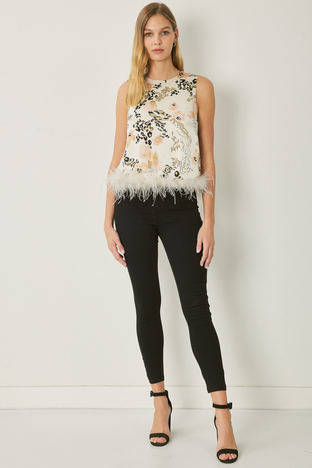 Stylish sleeveless print top with feather trim, perfect for coastal boutique clothing and tropical vacation dresses.