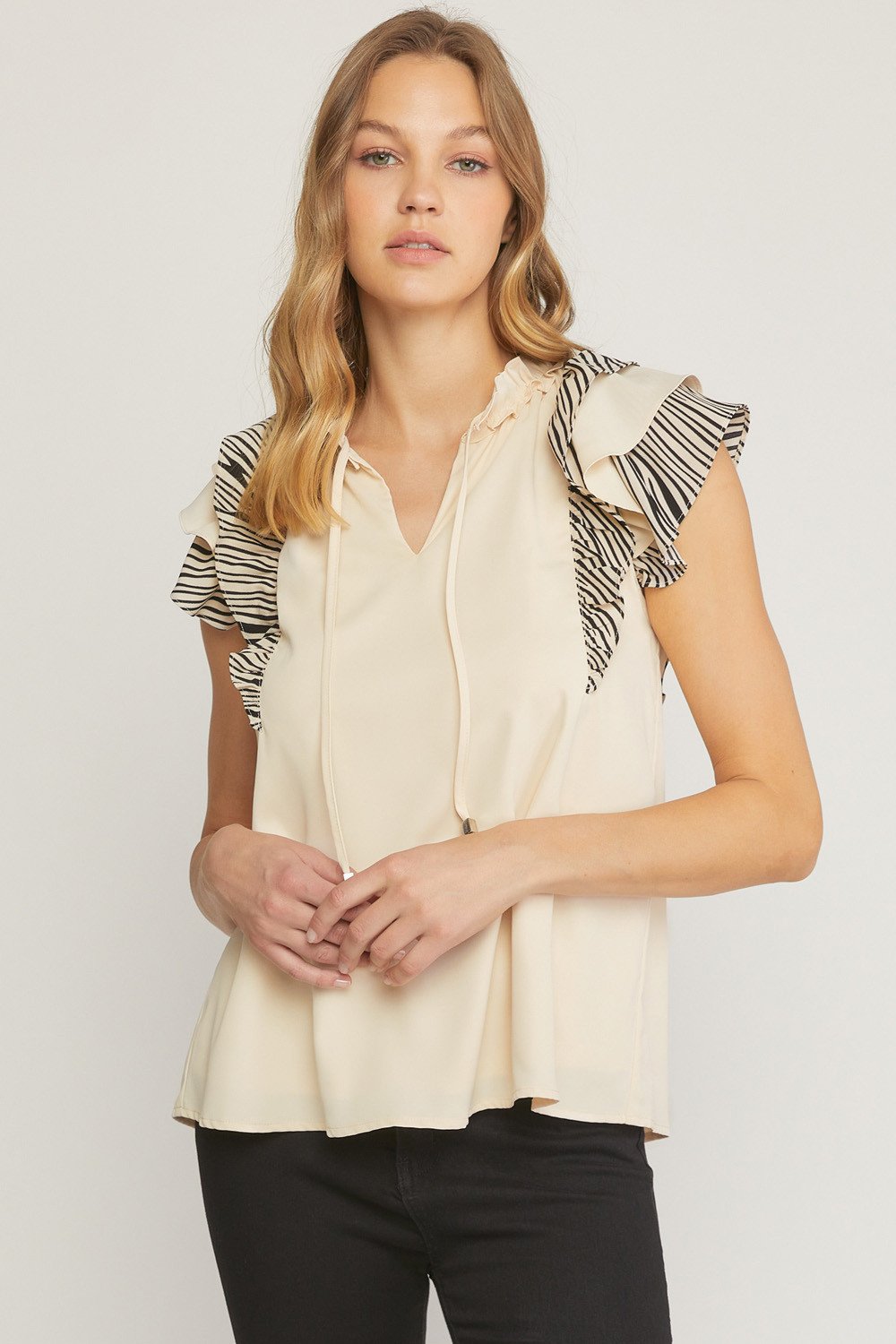 CREAM AND BLACK WITH SLEEVE DETAIL top from Raggdoll Boutique, perfect for trendy coastal style and summer outfits.
