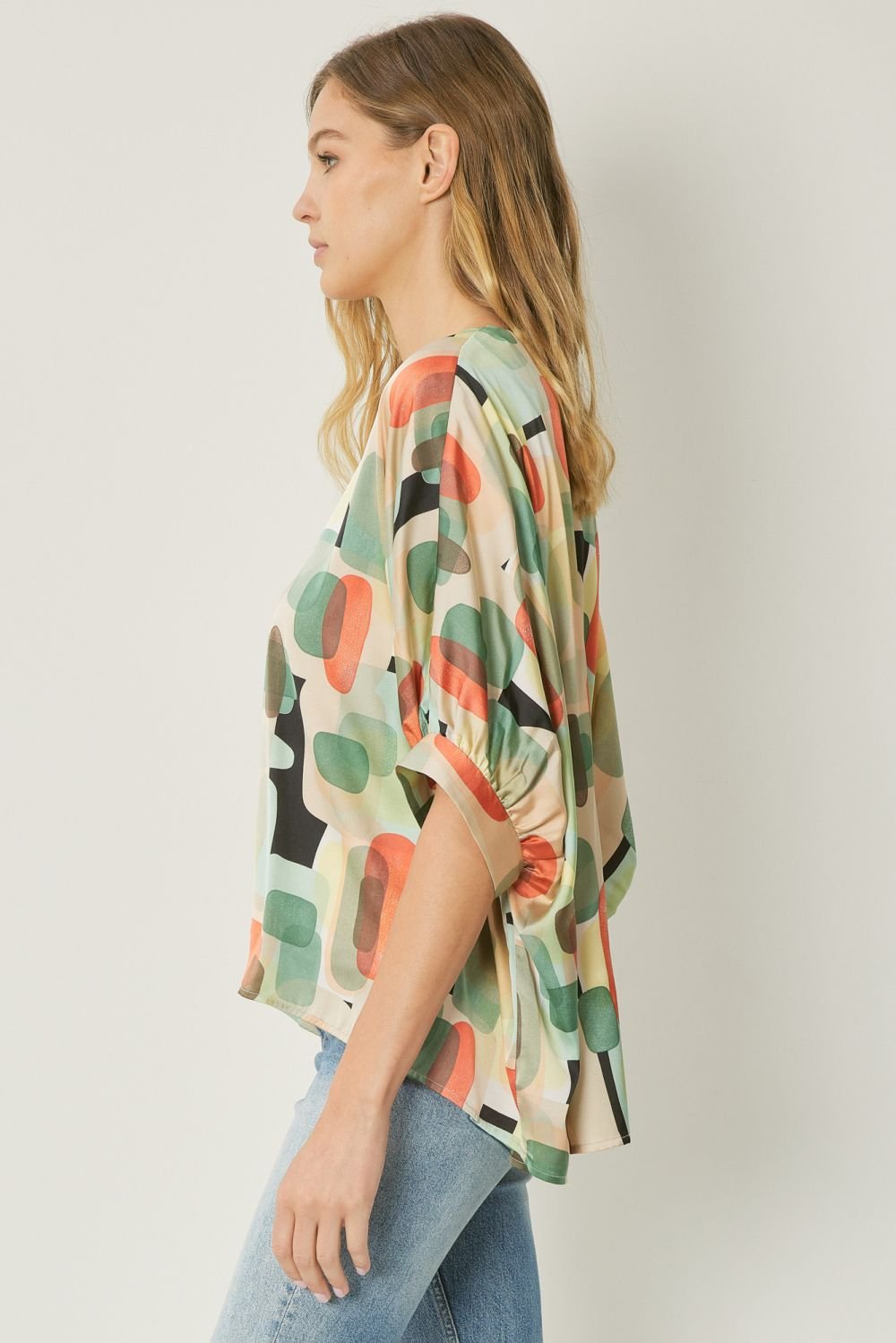 MINT MULTI GRAPHIC TOP featuring colorful abstract patterns, ideal for coastal boutique clothing and stylish summer looks.