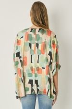 Mint multi graphic top from a coastal boutique, perfect for tropical vacations and stylish women's fashion.