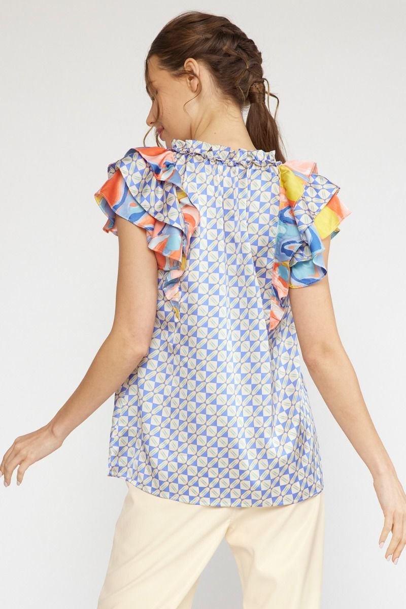 Back view of the BLUE COMBO TOP showcasing colorful ruffled sleeves, perfect for trendy coastal style.