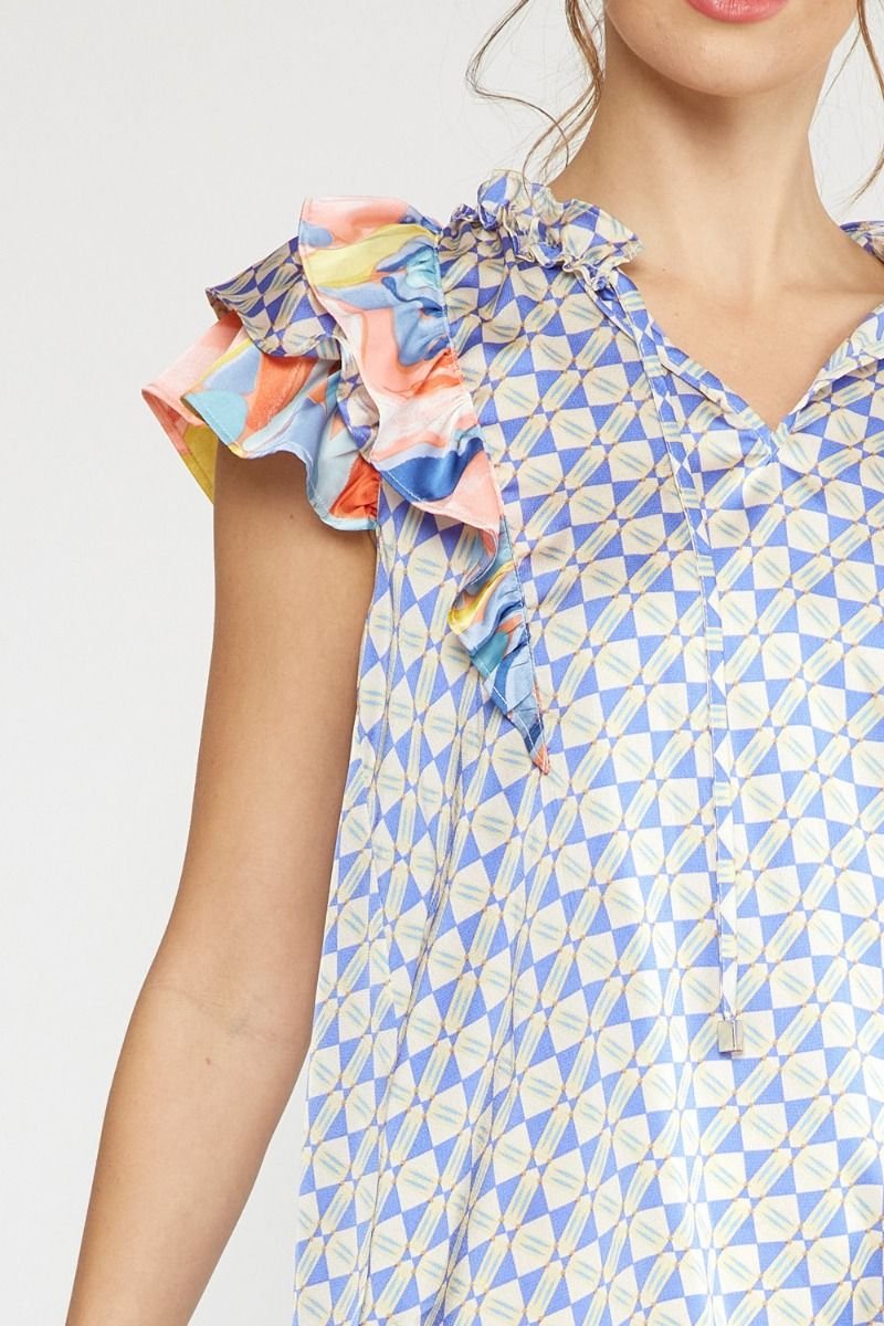 Women wearing a stylish BLUE COMBO TOP with colorful ruffle sleeves from Raggdoll Boutique, perfect for summer outfits Texas.