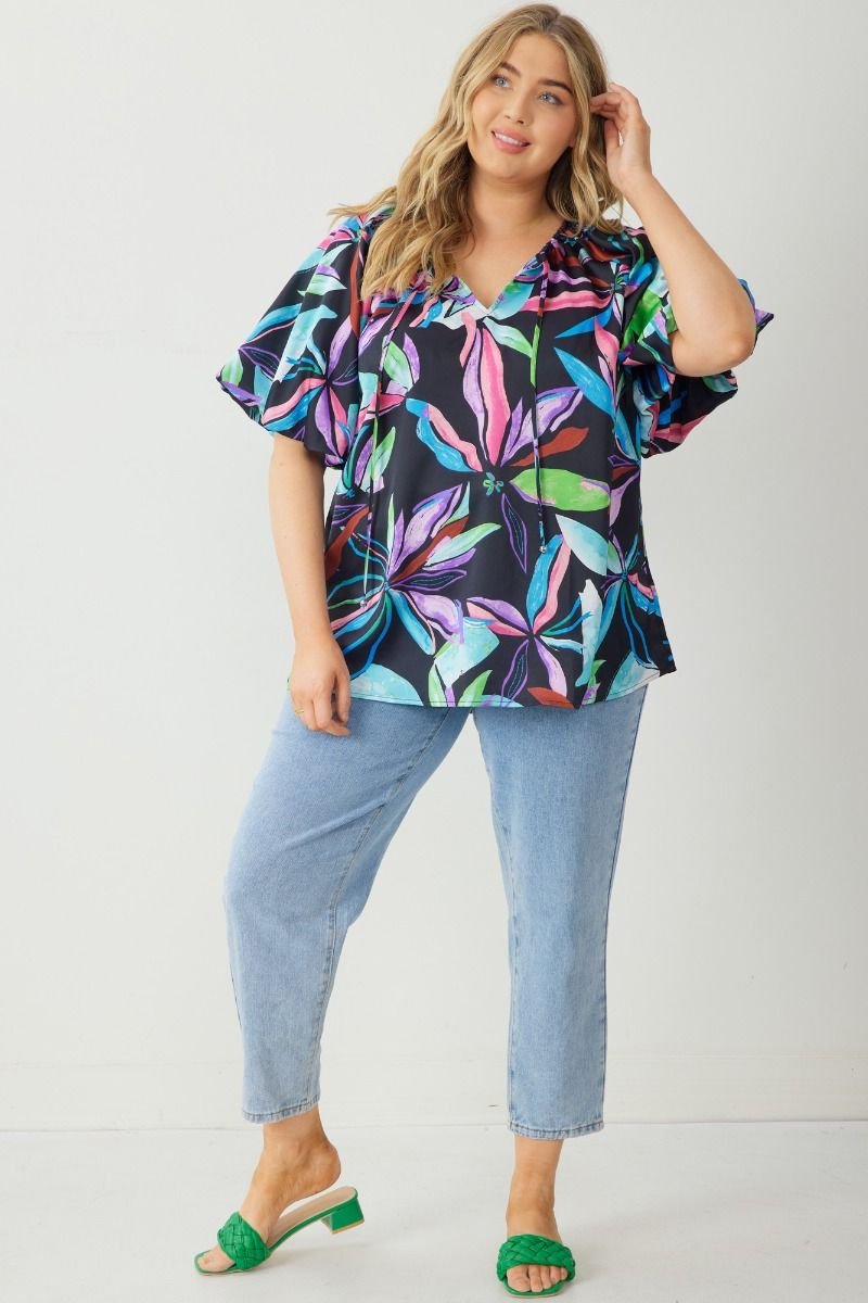 PLUS BLACK MULTI TOP WITH BUBBLE SLEEVE from Raggdoll Boutique showcasing trendy coastal style and vibrant colors.