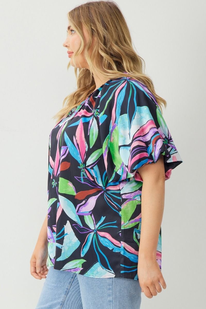 PLUS BLACK MULTI TOP WITH BUBBLE SLEEVE showcased in a vibrant floral design, perfect for trendy coastal style from Raggdoll Boutique.