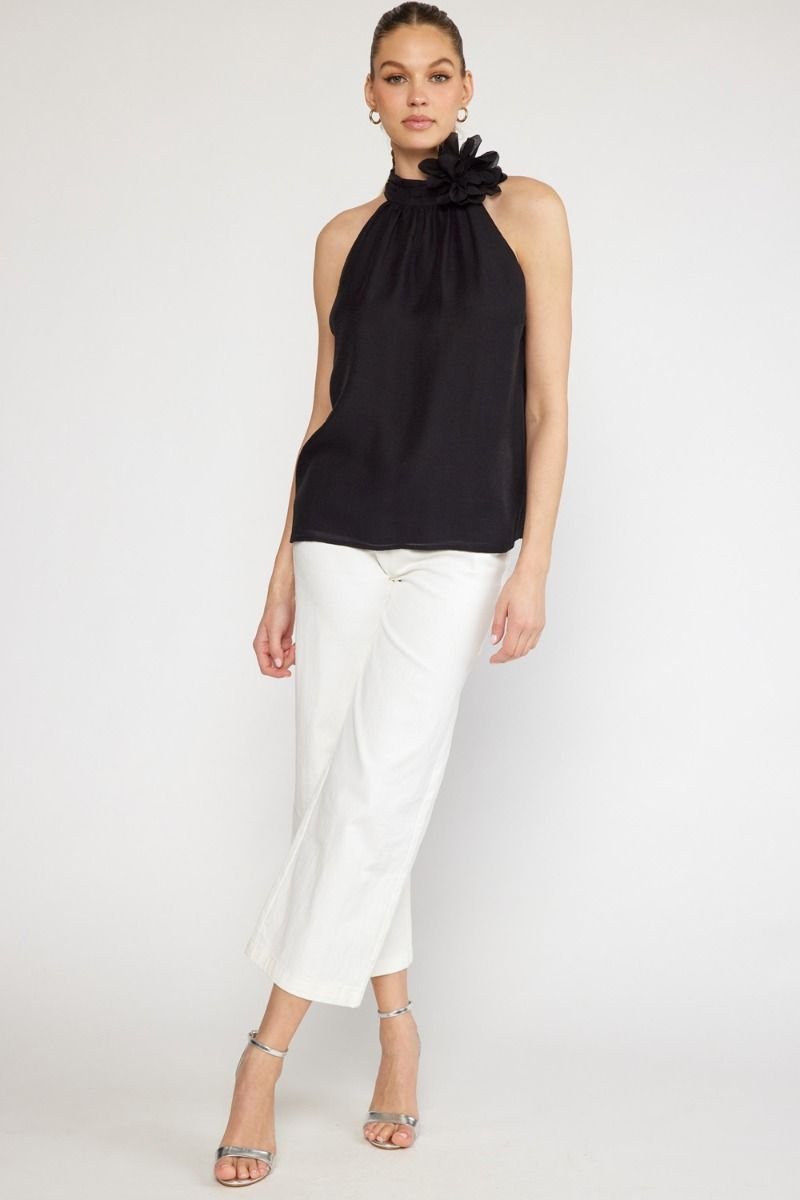 BLACK HALTER TOP WITH FLOWER DETAIL from Raggdoll Boutique, perfect for trendy coastal style and summer outfits Texas.