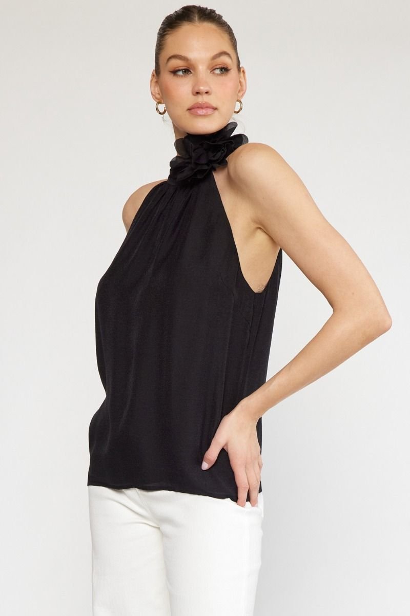 BLACK HALTER TOP WITH FLOWER DETAIL from Raggdoll Boutique, perfect for trendy coastal style in Port Aransas.