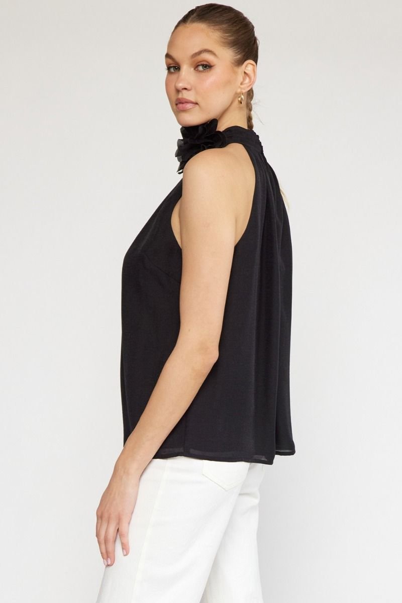 BLACK HALTER TOP WITH FLOWER DETAIL from Raggdoll Boutique, perfect for coastal fashion and summer outfits Texas.